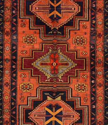 An orange/black Caucasion/Anatolian carpet