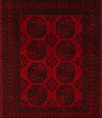 An Afghan/Pakistan carpet in red with 8 round motifs in the middle