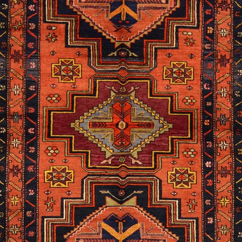 An orange/black Caucasion/Anatolian carpet